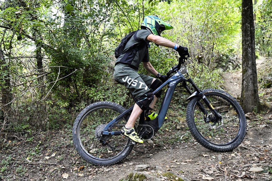 Off road Cyclist riding uphill. Using Blue Label highest quality fork seals.